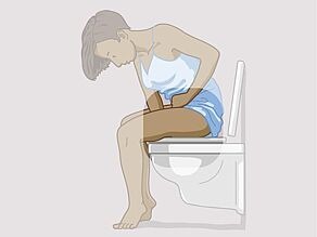 Woman sitting on the toilet and holding one arm between her legs. The focus is on the arm between her legs.